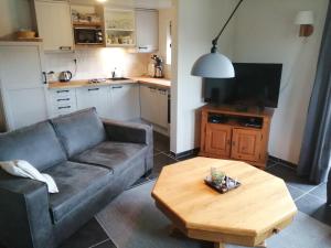 a living room with a couch and a coffee table at rikobravo in Meppen