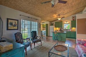 a living room with green cabinets and a kitchen at Quaint Countryside Casita 45 Mi to Ft Worth in Buckner