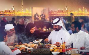 
a large group of people eating food in a restaurant at Crowne Plaza Dubai Festival City in Dubai
