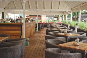 a row of tables and chairs in a restaurant at Wieniawa in Leszno