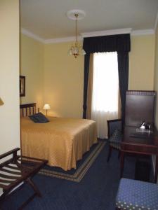 Un pat sau paturi într-o cameră la Château Visz