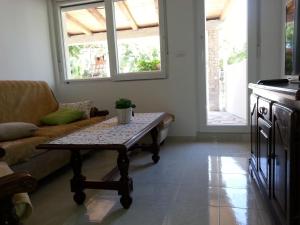 a living room with a coffee table and a couch at Apartments Mateljan 1715 in Kaštela