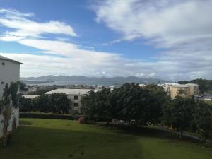 a view of a park with trees and buildings at F2 Lamentin in Le Lamentin