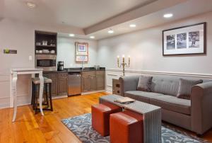 a living room with a couch and a table at Bluegreen Vacations Club La Pension in New Orleans