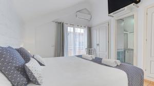A bed or beds in a room at Villa Maday