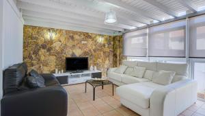 A television and/or entertainment centre at Villa Maday