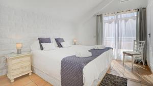 A bed or beds in a room at Villa Maday