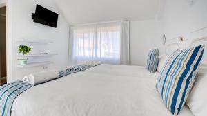 A bed or beds in a room at Villa Maday