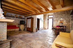 a living room with a couch and a table at Kaary Country in Santa Croce Camerina