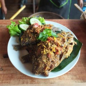 a white plate of food on a table at Umah lumbung bedugul in Bedugul