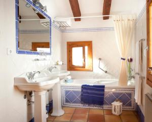a bathroom with a tub and a sink and a tubermottermott at Hotel Abaco Altea in Altea +37 photos