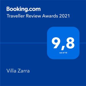 a screenshot of a cell phone with a travel review award at Villa Zarra in Klimno