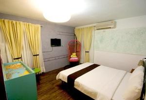מיטה או מיטות בחדר ב-珊瑚礁民宿