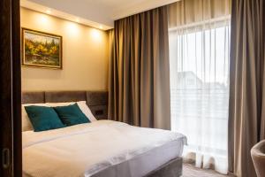 Ένα ή περισσότερα κρεβάτια σε δωμάτιο στο NEW Garni Hotel FILIA