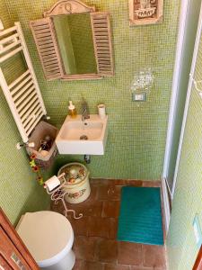 a small bathroom with a sink and a toilet at Da Artù in Cittaducale +33 photos