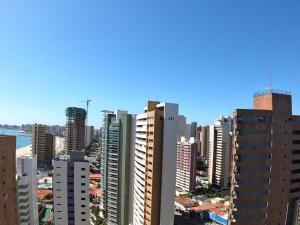 a view of a city skyline with tall buildings at VIP Beira Mar Residence in Fortaleza