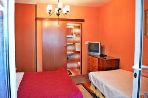 Postel nebo postele na pokoji v ubytování Apartments Desa 572