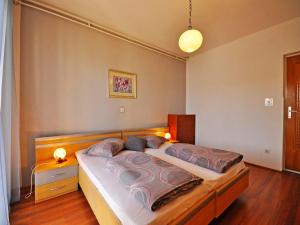 a bedroom with a large bed in a room at Apartments Paliska in Rabac