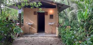 a building with a toilet in the middle of a forest at Centro Ecoturistico Ya´ajche in Lacanjá