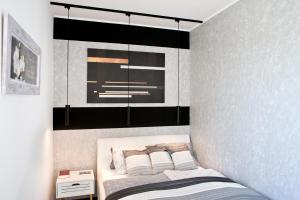 Postel nebo postele na pokoji v ubytování A-765 Apartman