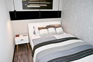 Postel nebo postele na pokoji v ubytování A-765 Apartman
