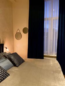 Postel nebo postele na pokoji v ubytování B&B Augusto
