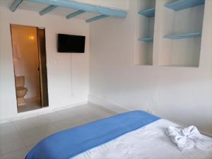 Laureles de la Villa客房内的一张或多张床位