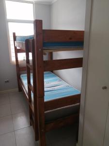 a couple of bunk beds in a room at vista playa los molles in Los Molles