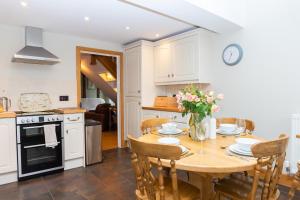 a kitchen and dining room with a table and chairs at Stoney Moat in Shrewsbury