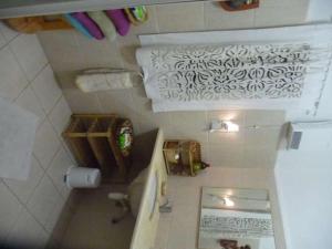 an overhead view of a bathroom with a sink and a tub at The Artist's House Overlooking the Bay of Haifa in Haifa