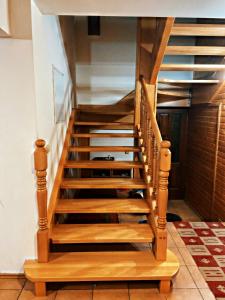 a staircase in a house with wooden steps at Chalupa ŠŠ in Vlachy