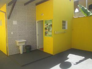 a bathroom with a toilet and a sink at Suítes Cantinho do Sossego Ubatuba in Ubatuba +30 photos