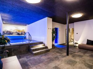 Postel nebo postele na pokoji v ubytování Garni Hotel Mezdi