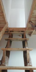 a wooden shelf on the ceiling of a room at Las zarinas 2 in Trapiche