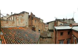 an aerial view of an old city with roofs at STUDIO COSY - HYPERCENTRE - CALME - WIFI - TV in Toulouse