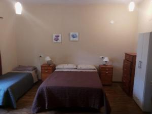 En eller flere senge i et værelse på Pescadores Departamentos