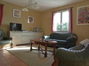 a living room with two couches and a coffee table at Spacious villa in Piquecos with private pool in Piquecos