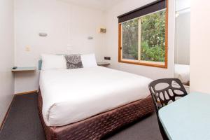 A bed or beds in a room at BIG4 Melbourne Holiday Park
