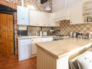 Kuchyň nebo kuchyňský kout v ubytování Hitchens Cottage