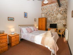 Postel nebo postele na pokoji v ubytování Hitchens Cottage