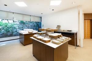 a kitchen with a counter with baskets of food at The OneFive Okayama in Okayama