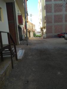 an empty parking lot next to a building at Bob Marley Homestay in Hurghada