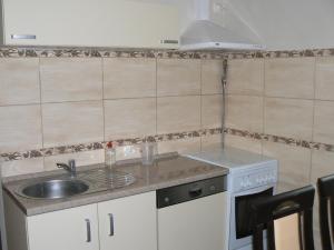 a kitchen with a sink and a stove at WaMa in Nowa Wieś +24 photos