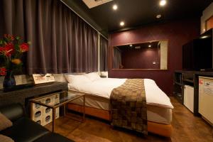 Postel nebo postele na pokoji v ubytování HOTEL Kslit Adult Only
