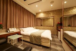 Postel nebo postele na pokoji v ubytování HOTEL Kslit Adult Only