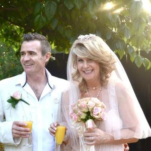 a bride and groom are posing for a picture at Midrand Wild Goose Guest House Backup Power in Midrand