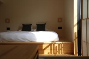 Llit o llits en una habitació de yubune