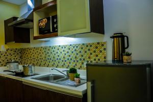 a kitchen with a sink and a counter top at Pico de Loro Hamilo Coast w/FREE KAYAK in Nasugbu