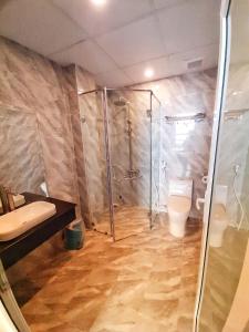 Koupelna v ubytování Rinny Hotel
