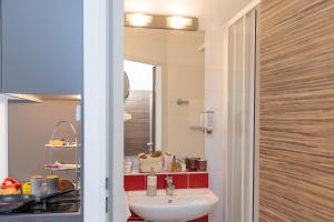 
a bathroom with a sink and a mirror at Senator Hotel Vienna in Vienna
